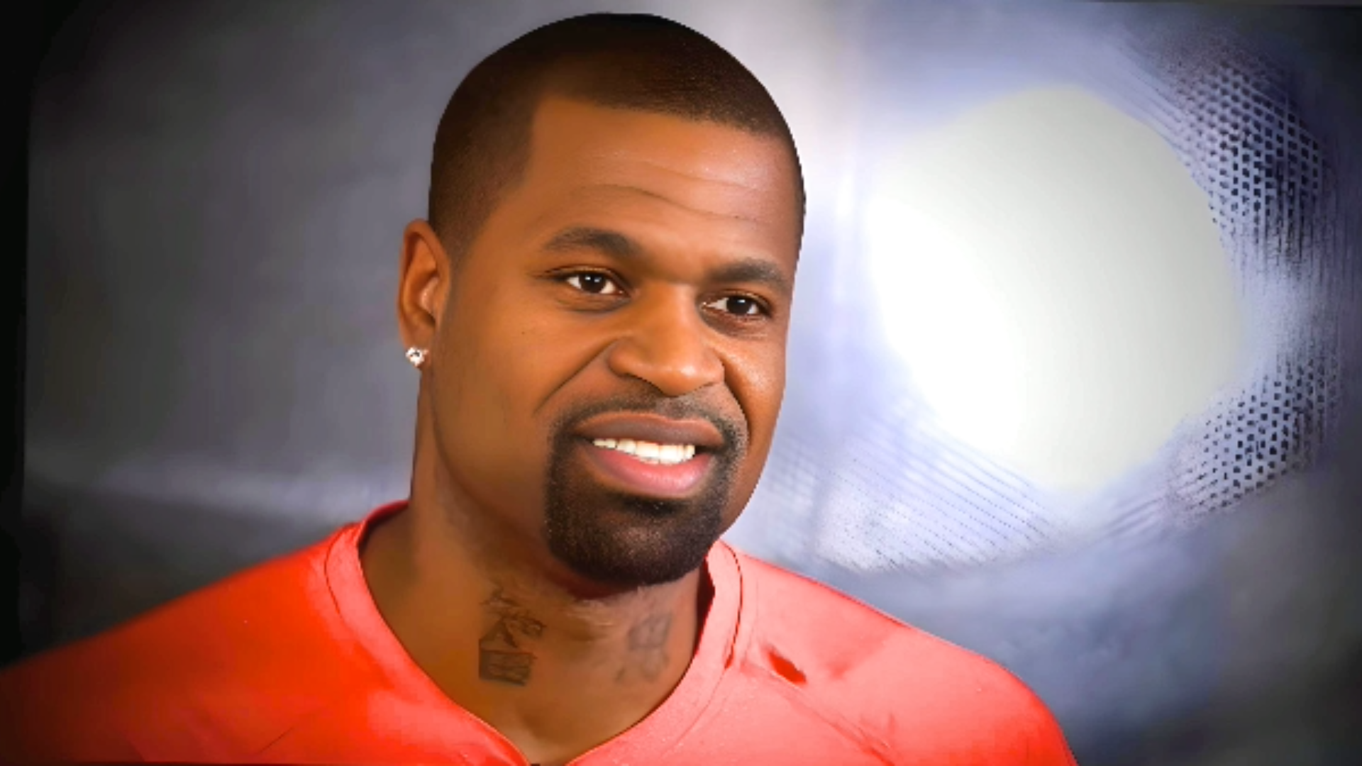 Former Pacer Stephen Jackson Net Worth, Smiling with Confidence wearing orange t-shirt