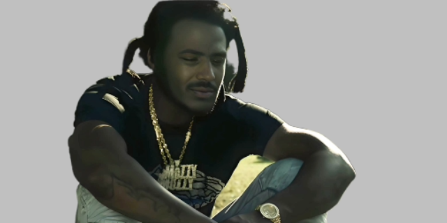 Mesmerizing picture of Mozzy sitting and wearing  black shirt