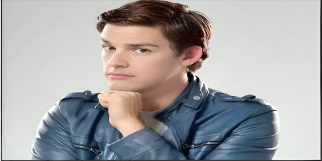 Mesmerizing picture of years old MatPat, wearing blue shirt with light background
