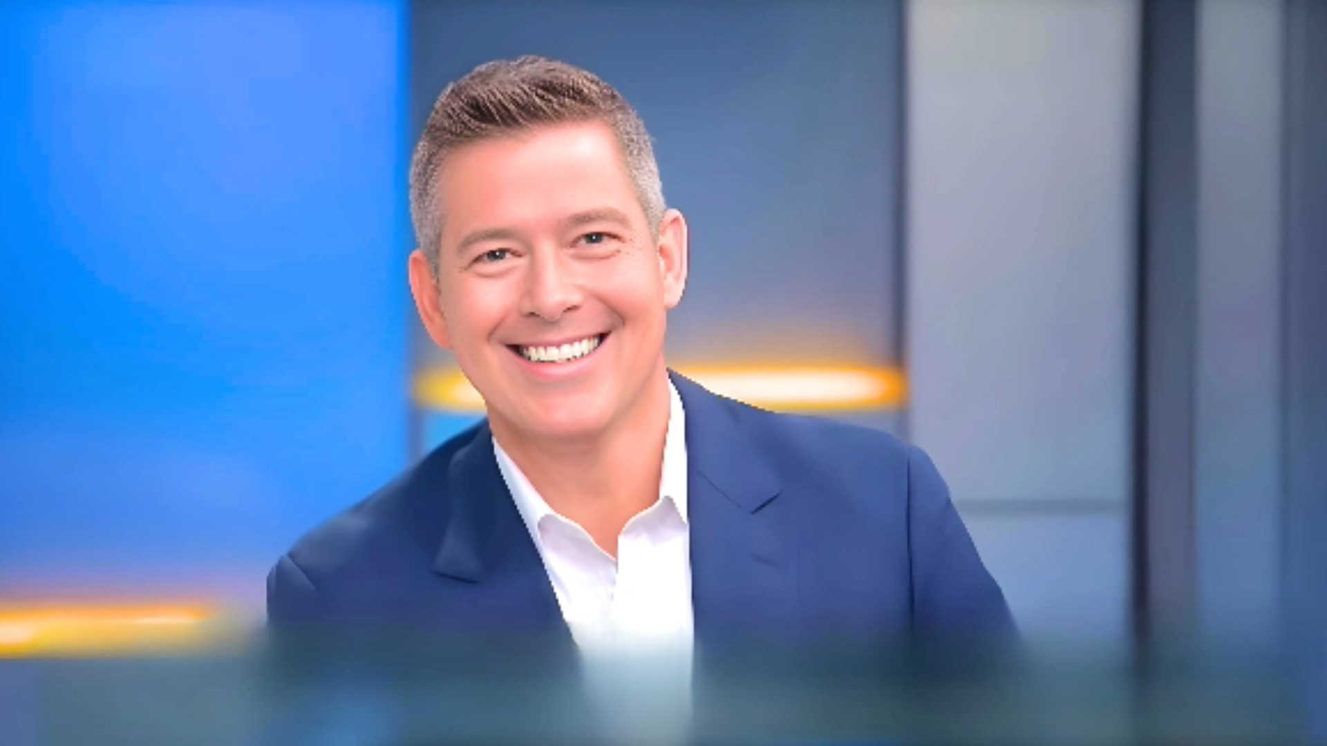 Sean Duffy smiling beautifuly, reflecting Sean Duffy net worth and remarkable career, wearing white shirt and Blue coat with bluish background