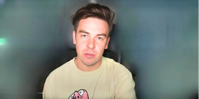 Beautiful picture of Cody Ko in off white t-shirt with bluish background depicting Cody Ko Net Worth: Salary And Earnings